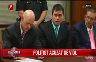 Politist acuzat de viol