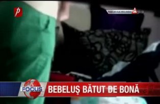 Bebeluş bătut de bonă
