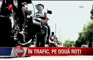 In trafic pe doua roti