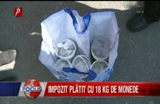 Impozit platit cu 18 kg de monede
